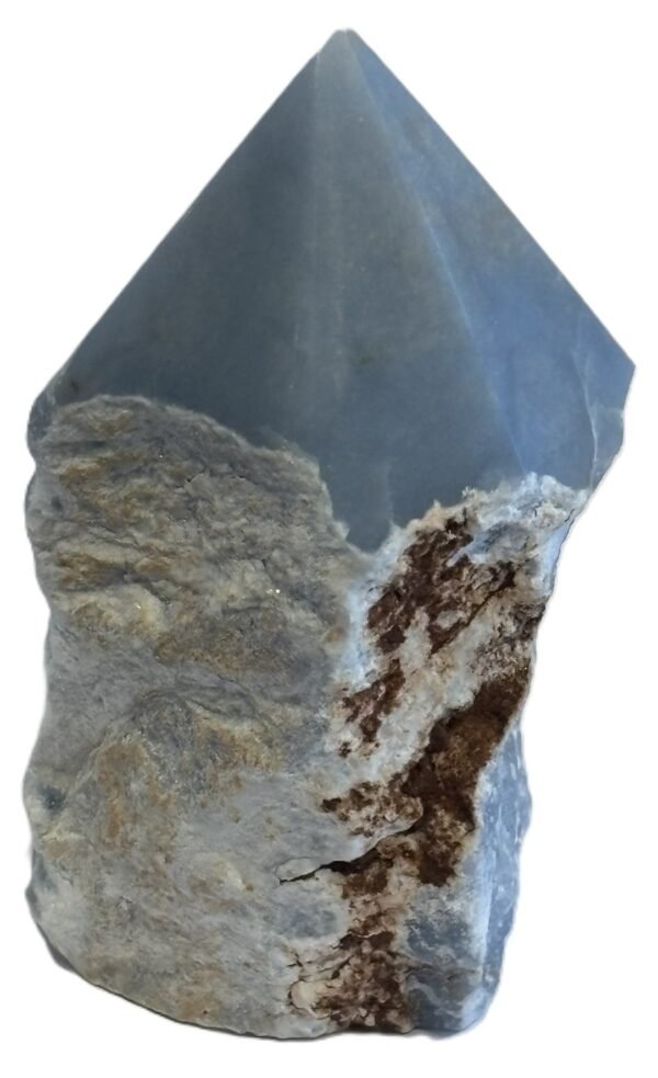 Natural rough angelite freeform with polished point 3 sians emporium Natural rough angelite freeform crystal with unpolished sides and a smooth polished blue point standing on a white background